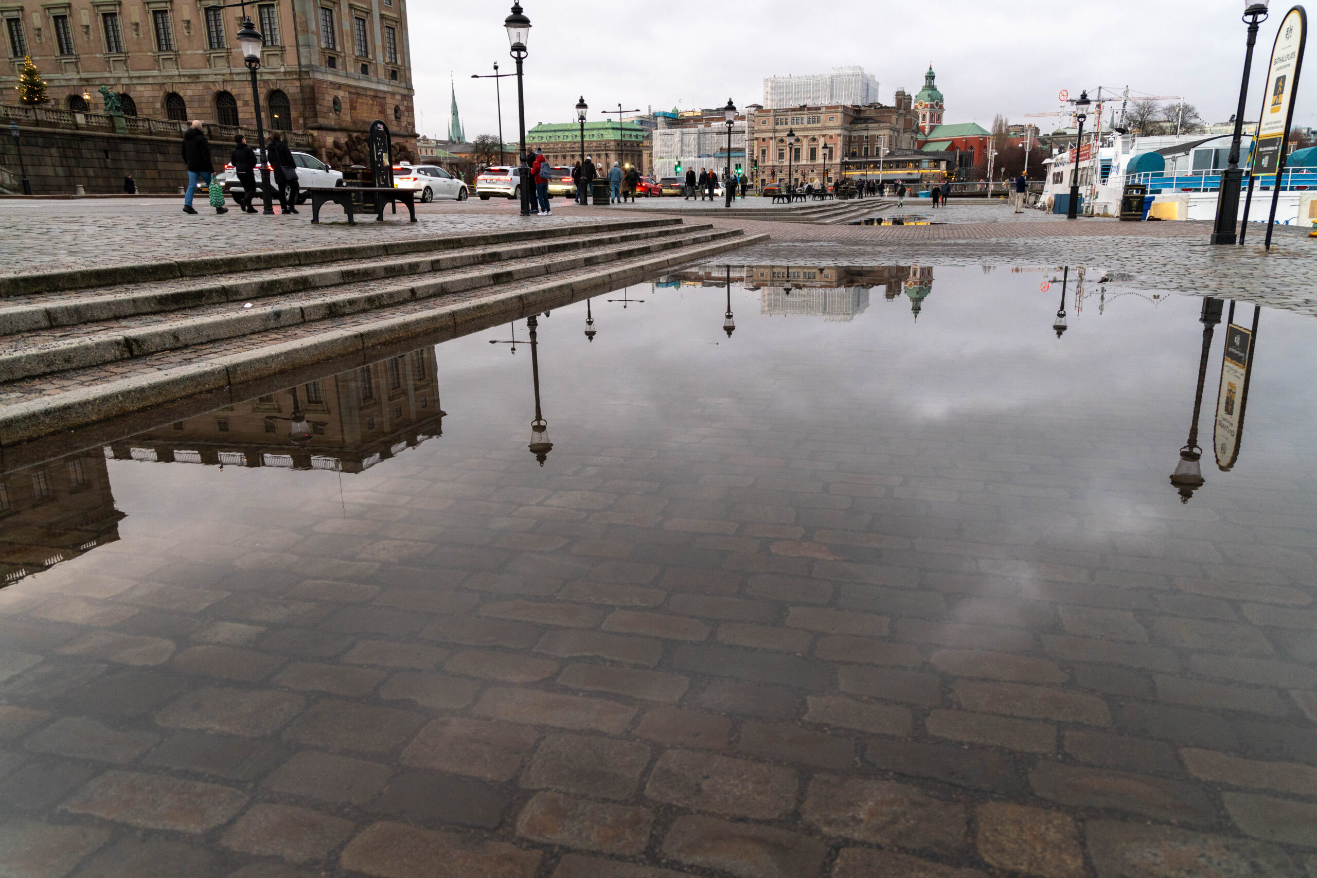 Water puddle reflection at Skeppsbron in Stockholm