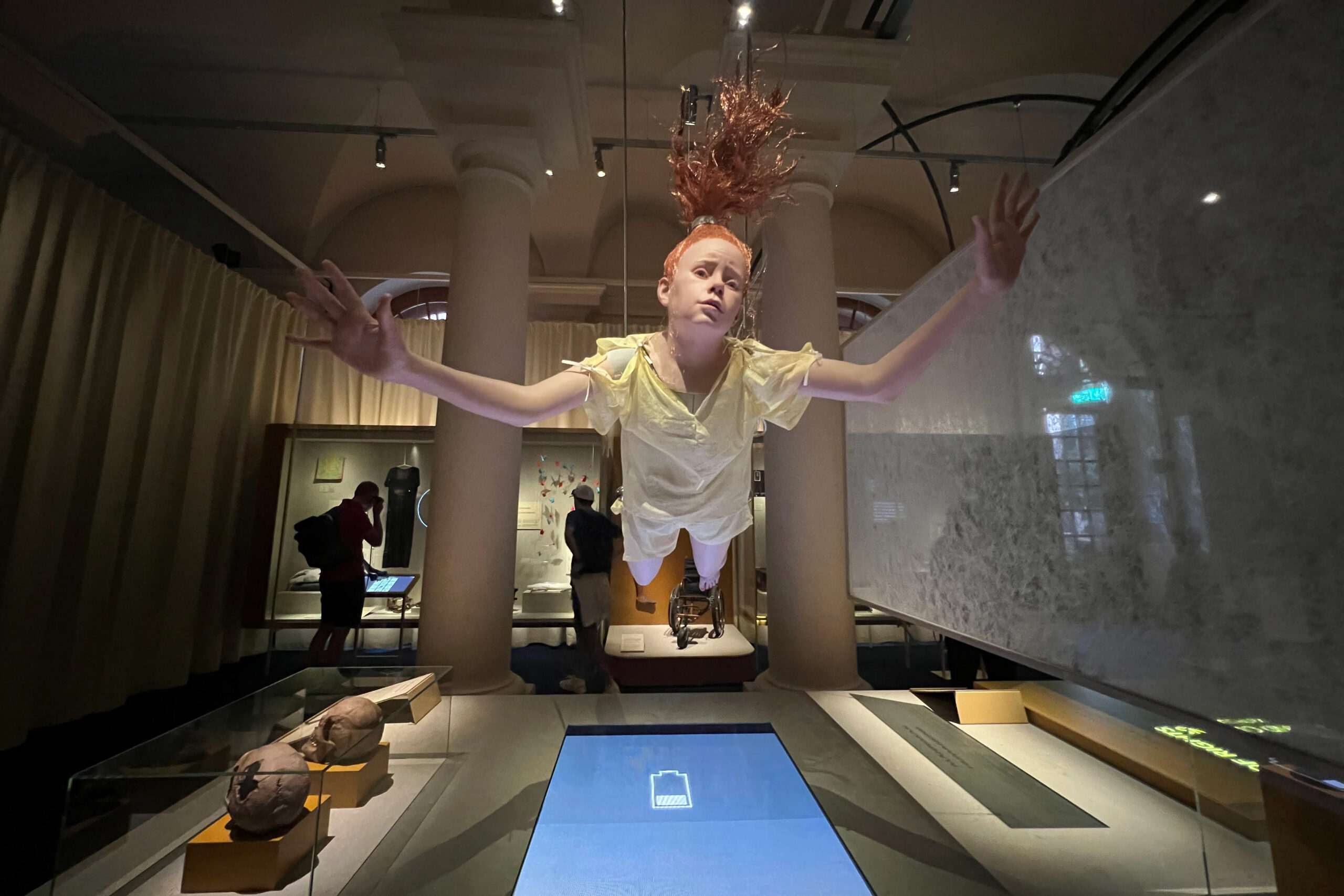 Human sized doll of a girl flying at the Nobel Prize Museum in Stockholm