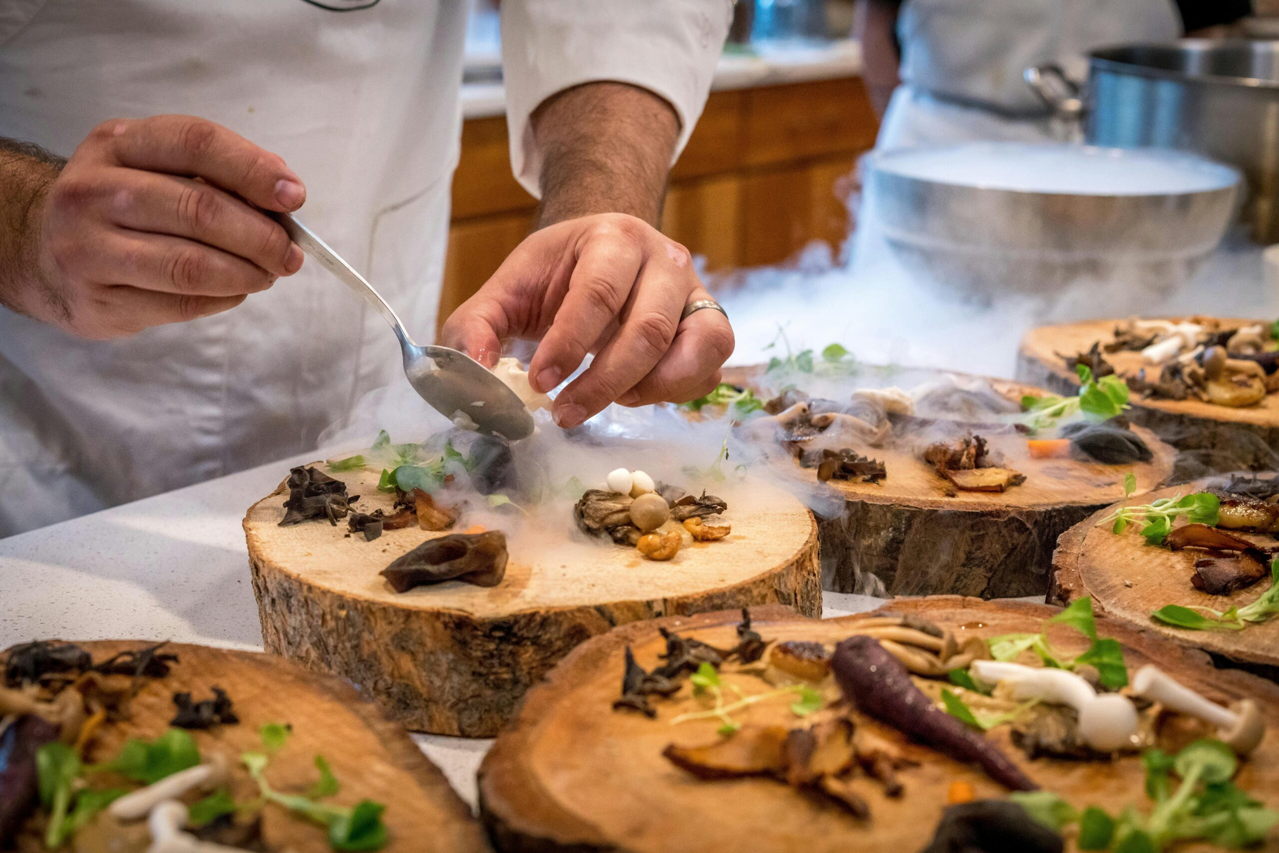 Chef preparing food on a tree slab