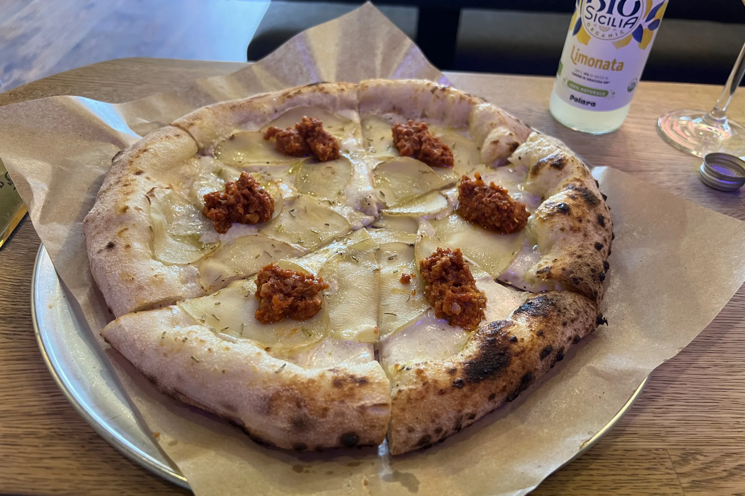 Vegetarian pizza with potatoes, as well as a soda at La Piccola Nonns in Stockholm