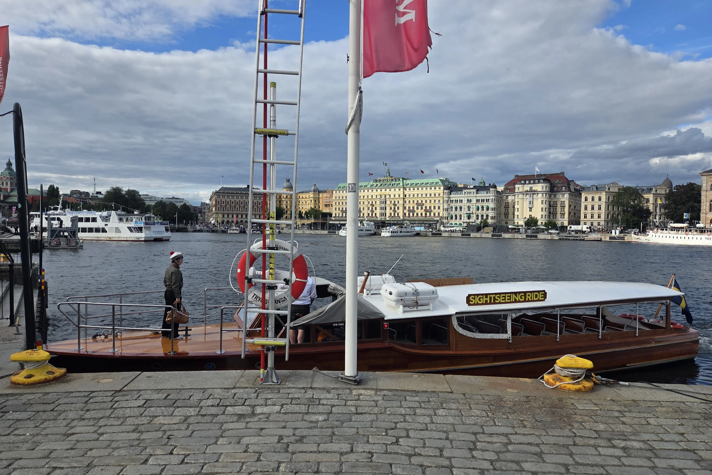 Sightseeing Ride company wooden boat in Stockholm during the summer.